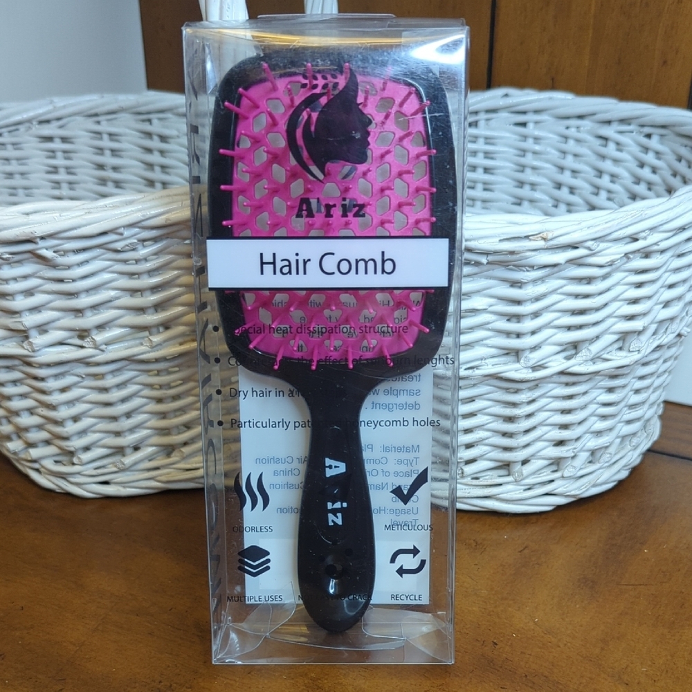 Pink and Black Hair Styling Tool with Cushioned Head